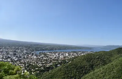 a bay and its town seen from the hill above