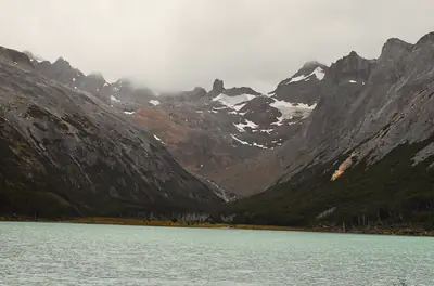 a lake lying below the mountains